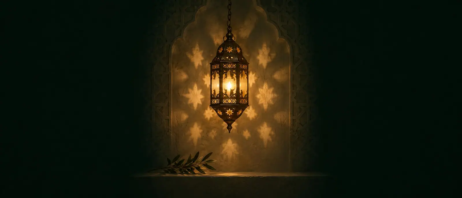 Illustrative image: a Moroccan brass lantern glowing in a carved plaster niche, with an olive sprig on the ledge