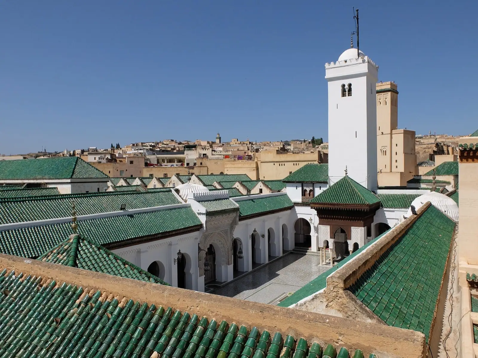 The courtyard and minaret of al-Qarawiyyin, Fez, seen from the rooftops.